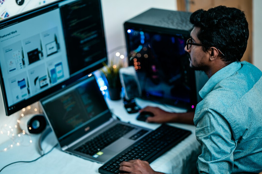 programmer coding at desk