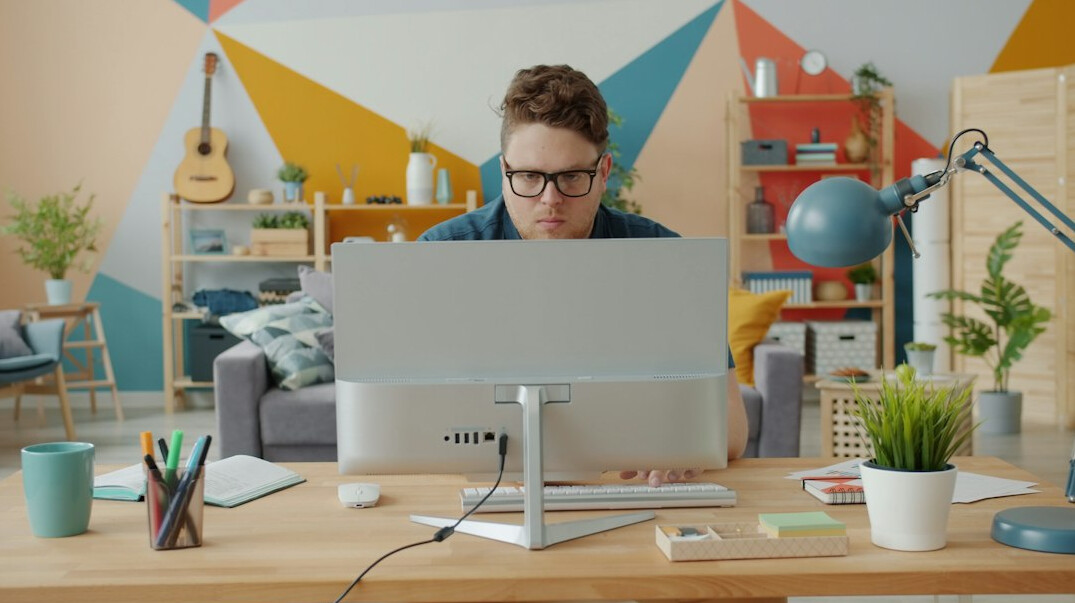 programmer coding at desk