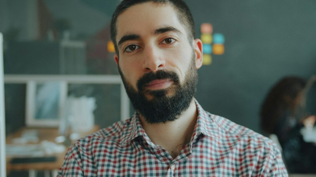 Croatian man software architect with glasses, studio portrait